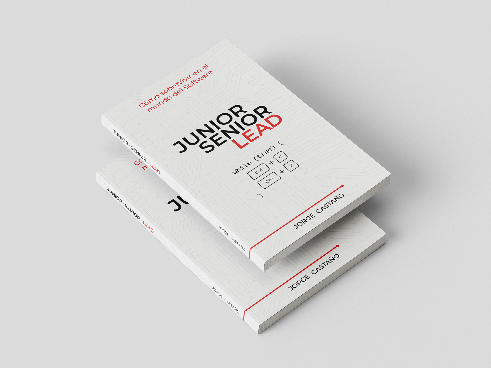 Un libro encima de otro sobre una superficie blanca.